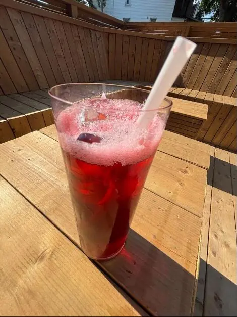 Agua de Jamaica over ice on the cedar patio